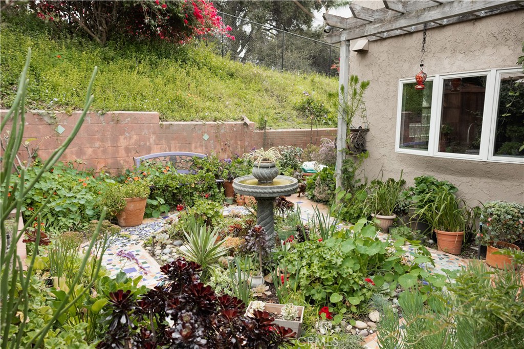 26251 Brookhollow Lake Forest, CA 92630 - Photo 24 of 27 front view of a house with a garden