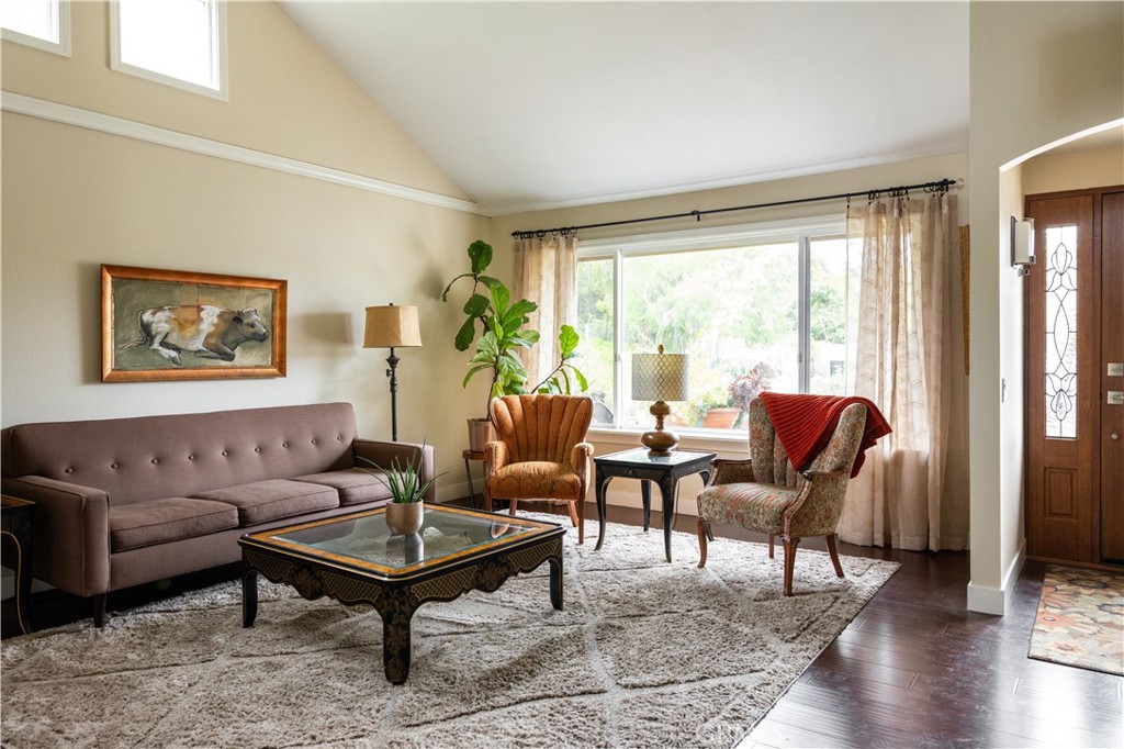 26251 Brookhollow Lake Forest, CA 92630 - Photo 3 of 27 a living room with furniture and a window with wooden floor