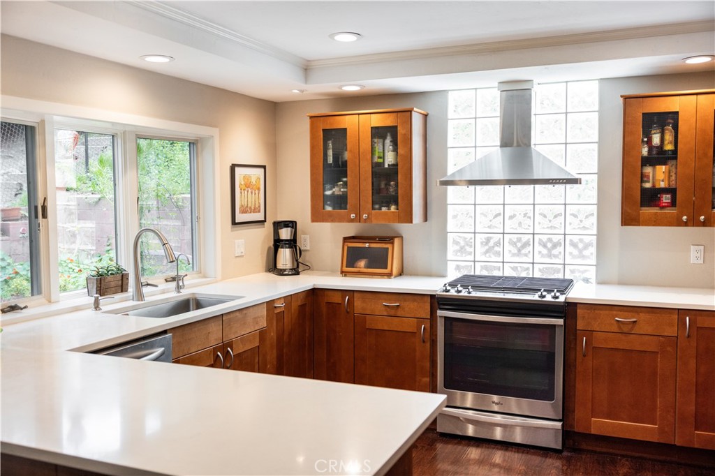 26251 Brookhollow Lake Forest, CA 92630 - Photo 5 of 27 a kitchen with a sink and large window
