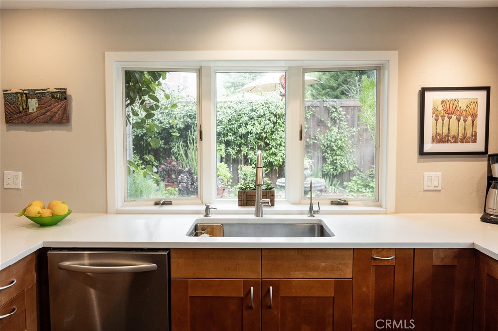 26251 Brookhollow Lake Forest, CA 92630 - Photo 7 of 27 a kitchen with a sink and a window