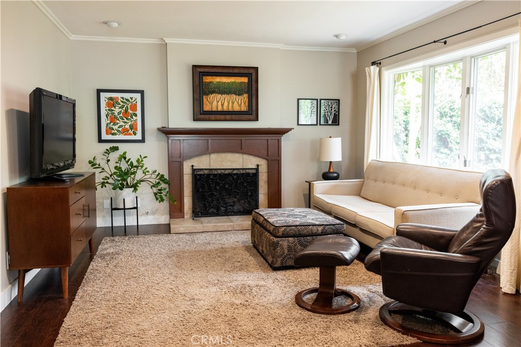 26251 Brookhollow Lake Forest, CA 92630 - Photo 10 of 27 a living room with furniture a window and a fireplace