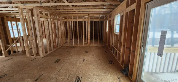 a view of a room with wooden walls
