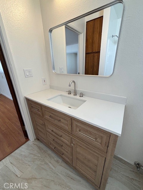 1901 Scott Road Burbank, CA 91504 - Photo 11 of 14 a bathroom with a sink and a mirror