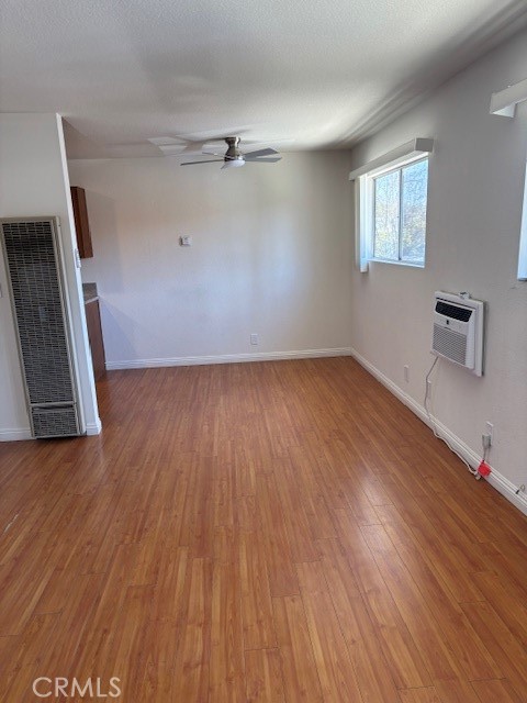 1901 Scott Road Burbank, CA 91504 - Photo 2 of 14 an empty room with wooden floor and windows