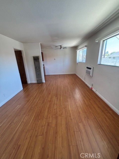 1901 Scott Road Burbank, CA 91504 - Photo 3 of 14 wooden floor in an empty room with a window