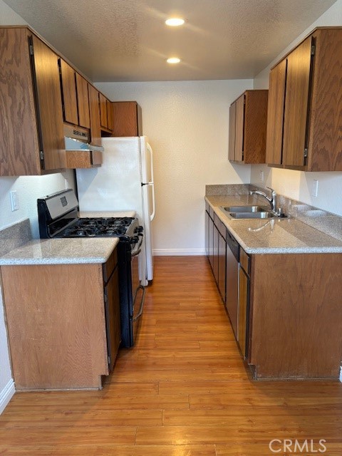 1901 Scott Road Burbank, CA 91504 - Photo 5 of 14 a kitchen with stainless steel appliances granite countertop a stove a sink and a refrigerator