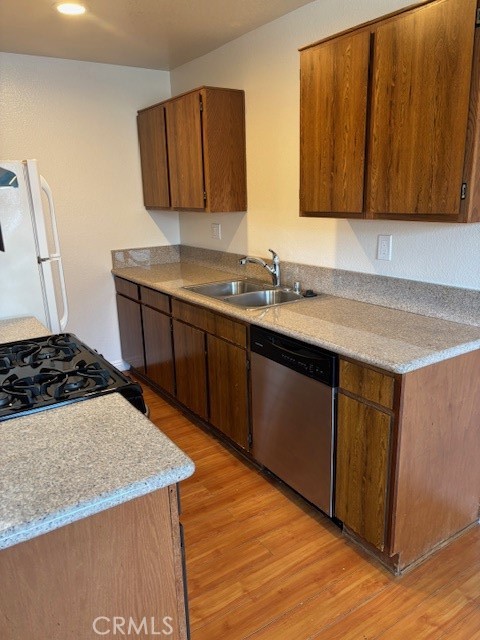 1901 Scott Road Burbank, CA 91504 - Photo 6 of 14 a kitchen with stainless steel appliances granite countertop a sink stove and cabinets
