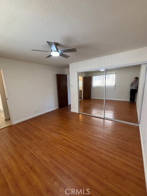 1901 Scott Road Burbank, CA 91504 - Photo 8 of 14 a view of empty room with wooden floor and fan