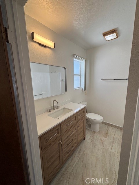 1901 Scott Road Burbank, CA 91504 - Photo 9 of 14 a bathroom with a toilet sink and mirror