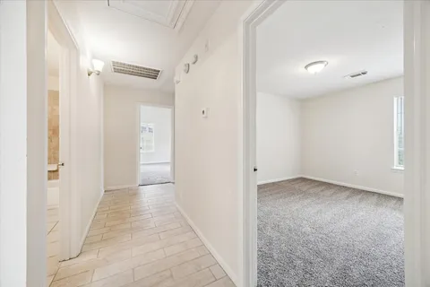 wooden floor in a hall with an entryway