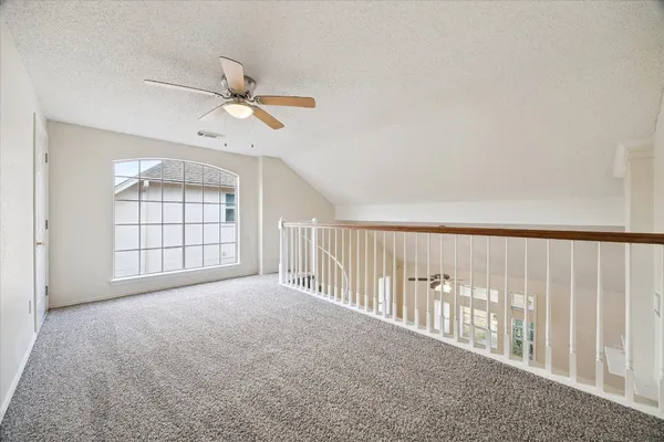 a large kitchen with stainless steel appliances granite countertop a stove a sink dishwasher and a refrigerator