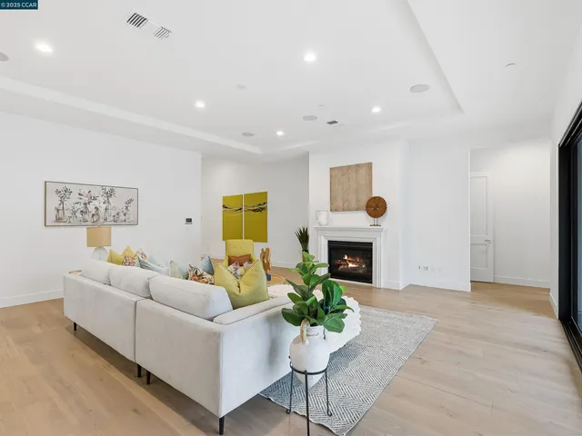 a living room with furniture rug and window
