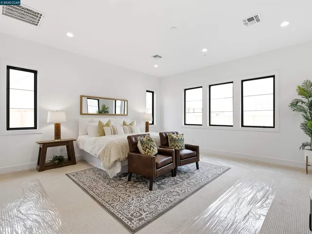 a bedroom with a bed and a fireplace