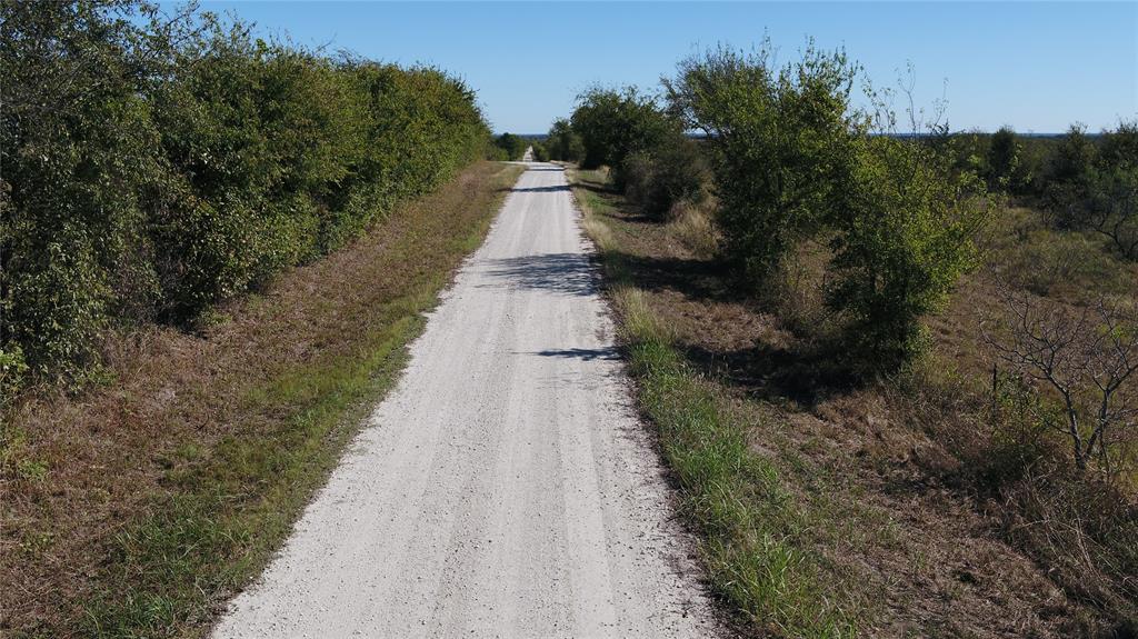 5 County Road Mexia, TX 76667 - Photo 32 of 33 a view of a pathway with a wrought fence