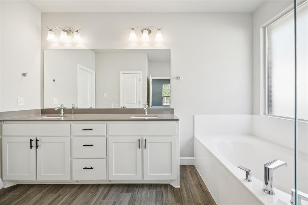 11520 Lavonia Road Fort Worth, TX 76244 - Photo 15 of 32 a bathroom with a sink and a mirror