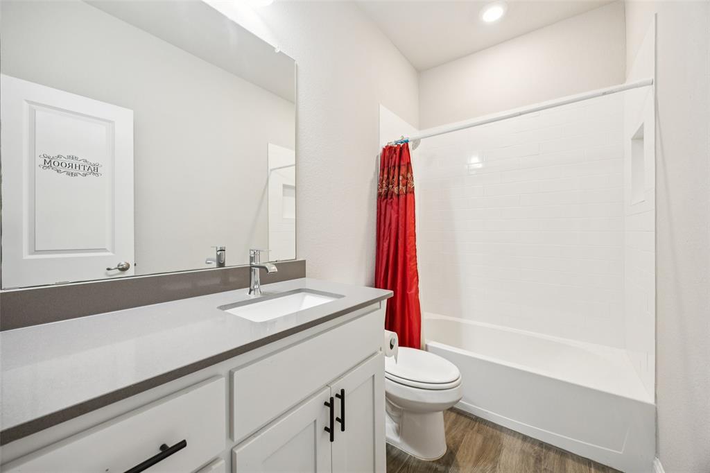 11520 Lavonia Road Fort Worth, TX 76244 - Photo 19 of 32 a bathroom with a sink and a mirror