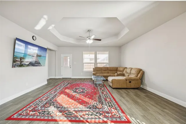 a living room with furniture and a rug