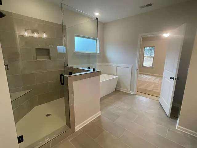 an empty room with windows and closet