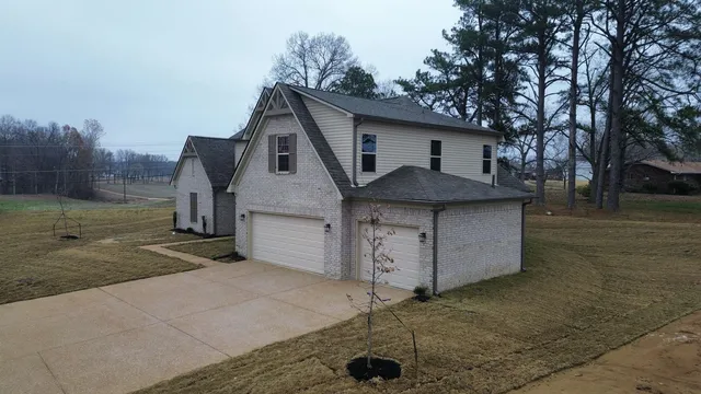 a view of a house with a yard