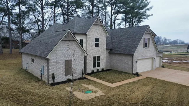 a kitchen with stainless steel appliances granite countertop a stove a sink dishwasher and a refrigerator