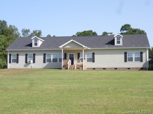 4375 Camp Creek Road Lancaster, SC 29720 - Photo 1 of 24 a front view of a house with a garden