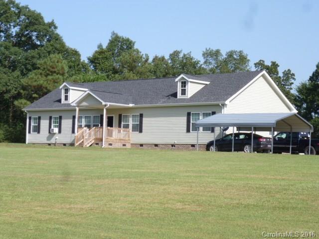4375 Camp Creek Road Lancaster, SC 29720 - Photo 2 of 24 a front view of a house with a garden