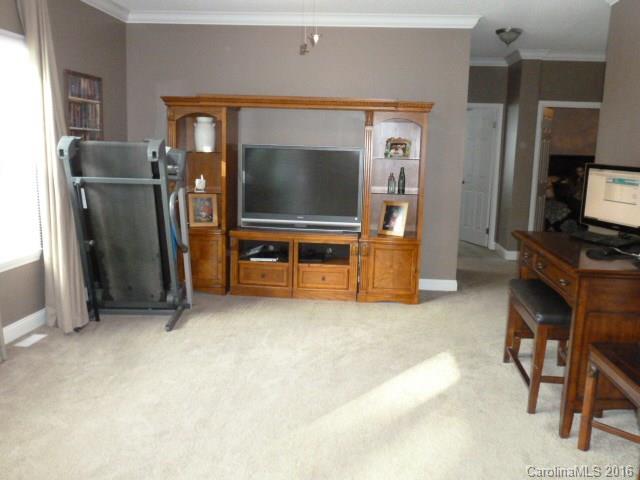 4375 Camp Creek Road Lancaster, SC 29720 - Photo 13 of 24 a view of room with flat screen tv and refrigerator