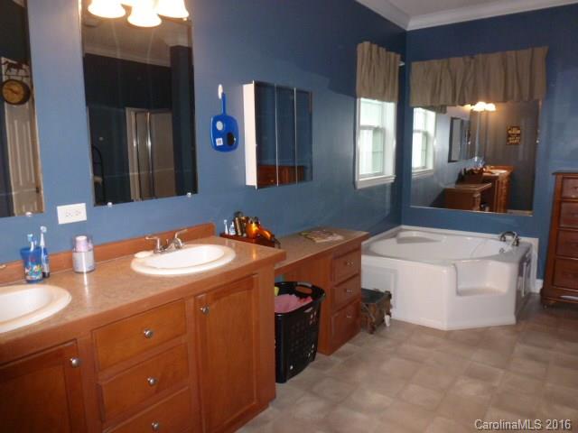 4375 Camp Creek Road Lancaster, SC 29720 - Photo 16 of 24 a bathroom with a sink double vanity and a mirror