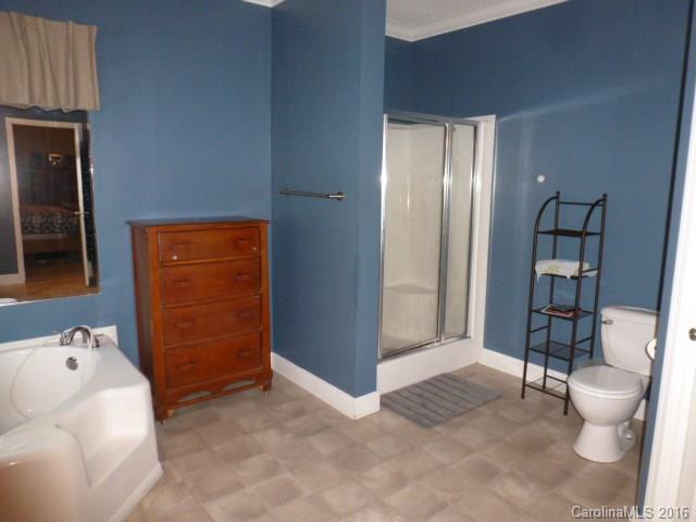 4375 Camp Creek Road Lancaster, SC 29720 - Photo 17 of 24 a bathroom with a toilet sink and mirror