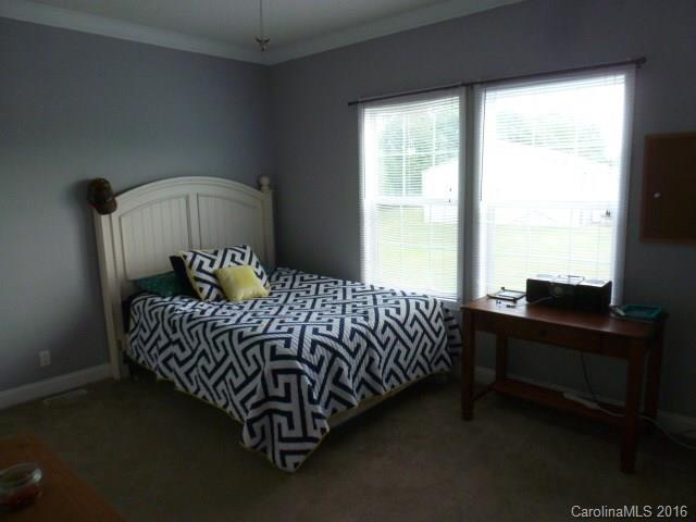 4375 Camp Creek Road Lancaster, SC 29720 - Photo 18 of 24 a bed sitting in a bedroom next to a window
