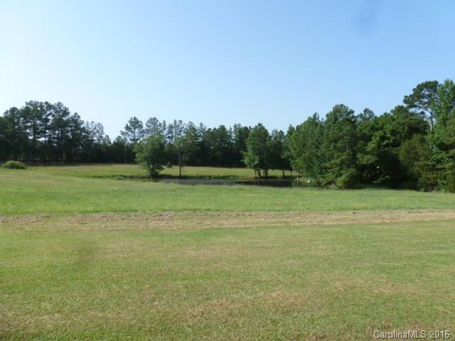 4375 Camp Creek Road Lancaster, SC 29720 - Photo 3 of 24 a view of a field with trees in the background