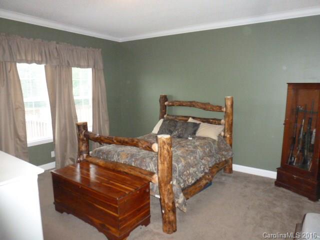 4375 Camp Creek Road Lancaster, SC 29720 - Photo 21 of 24 a bed sitting in a bedroom next to a window