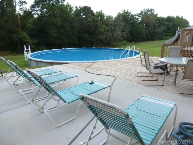 4375 Camp Creek Road Lancaster, SC 29720 - Photo 23 of 24 a view of a patio with chairs and a table