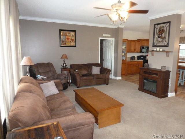 4375 Camp Creek Road Lancaster, SC 29720 - Photo 6 of 24 a living room with furniture and a chandelier