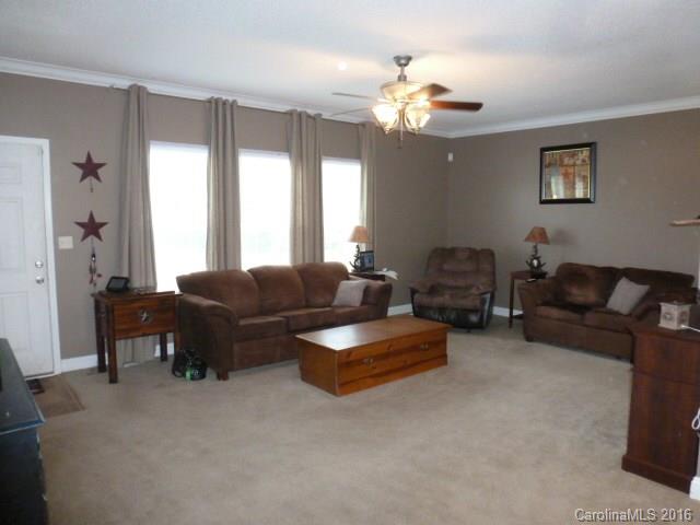 4375 Camp Creek Road Lancaster, SC 29720 - Photo 8 of 24 a living room with furniture and a large window