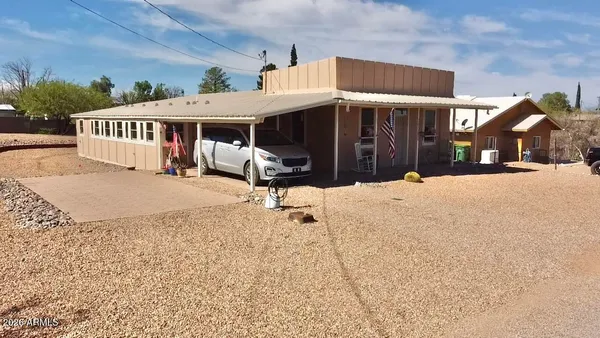 an aerial view of a house with a ocean view