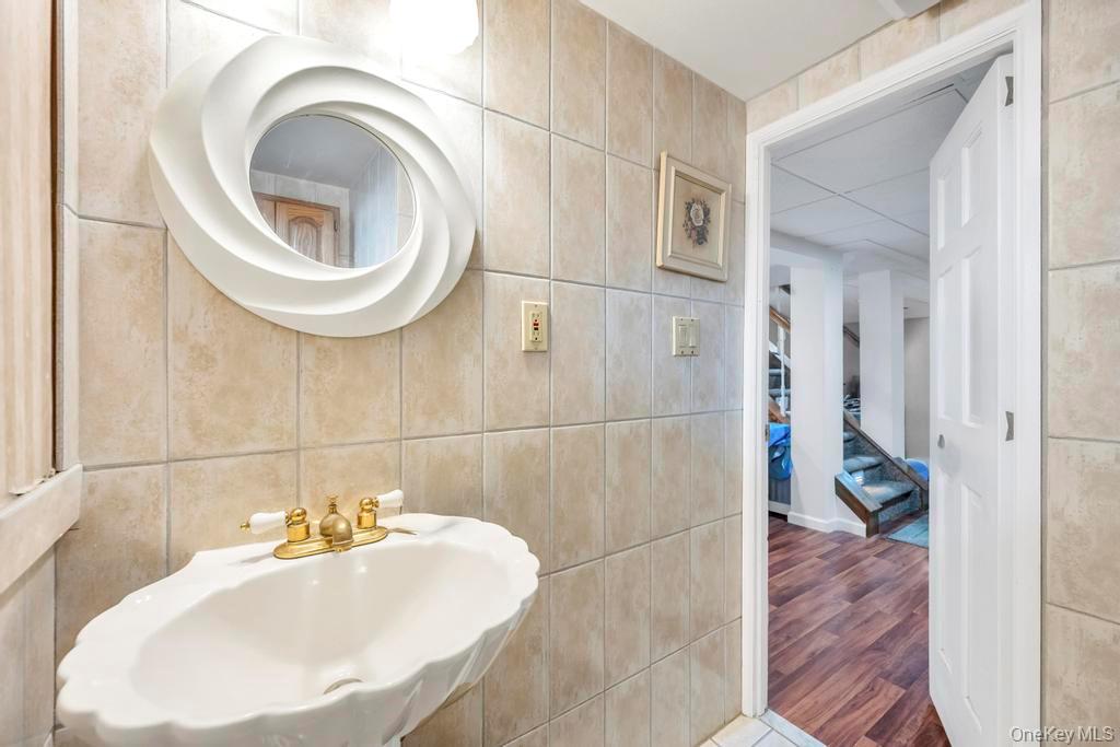 60 Essex Road Bethpage, NY 11714 - Photo 17 of 21 Bathroom with tile walls