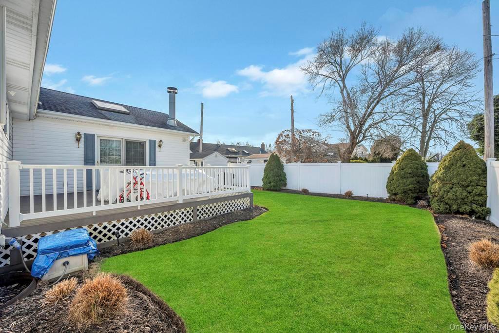 60 Essex Road Bethpage, NY 11714 - Photo 21 of 21 Fenced backyard with a deck