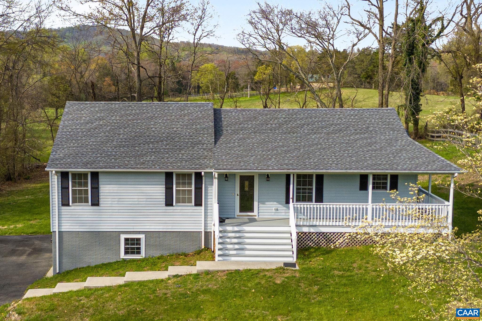 255 Rustling Oaks Way Ruckersville, VA 22968 - Photo 1 of 18 a house that has tree in front of it