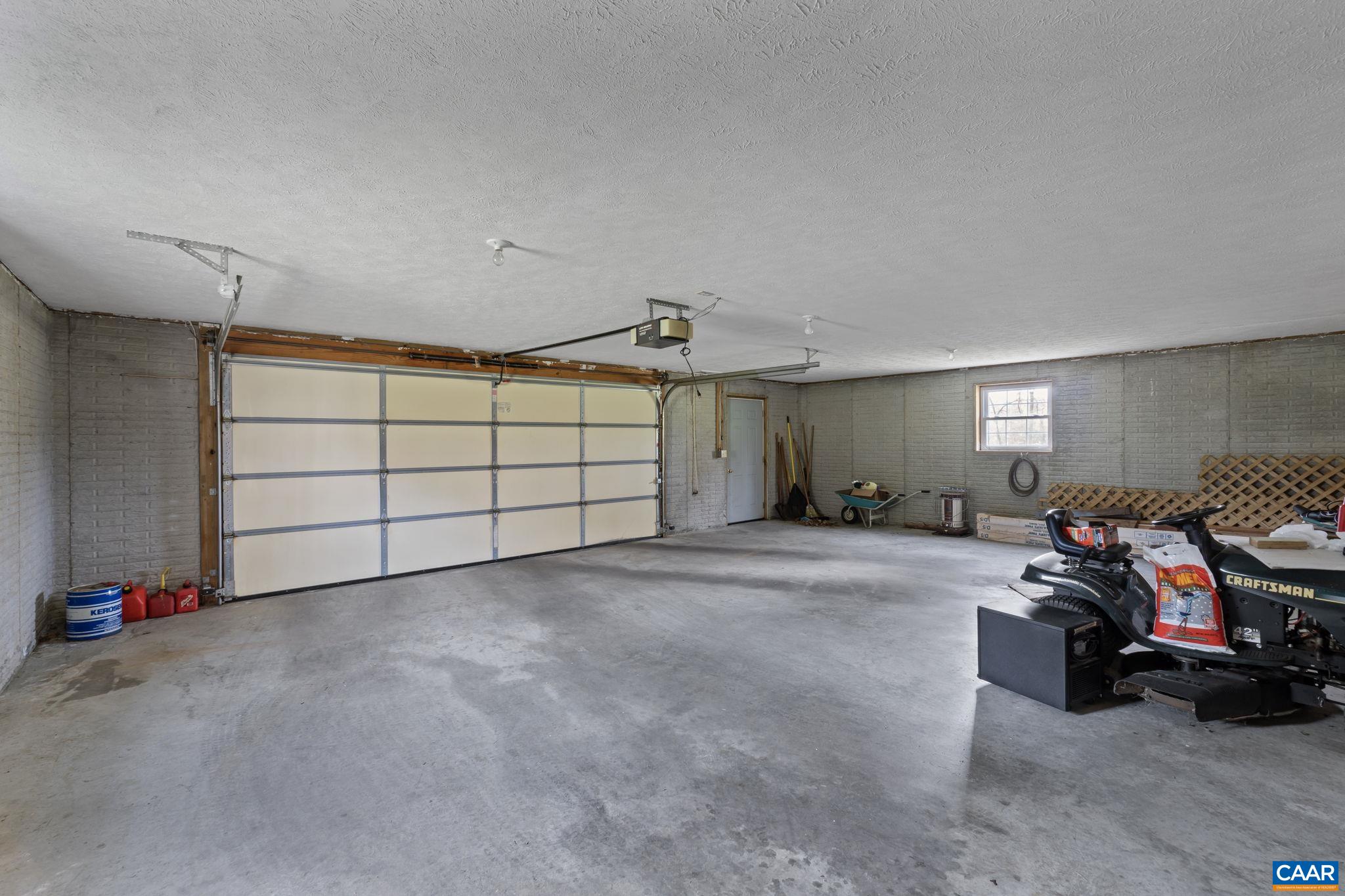 255 Rustling Oaks Way Ruckersville, VA 22968 - Photo 16 of 18 a view of a garage