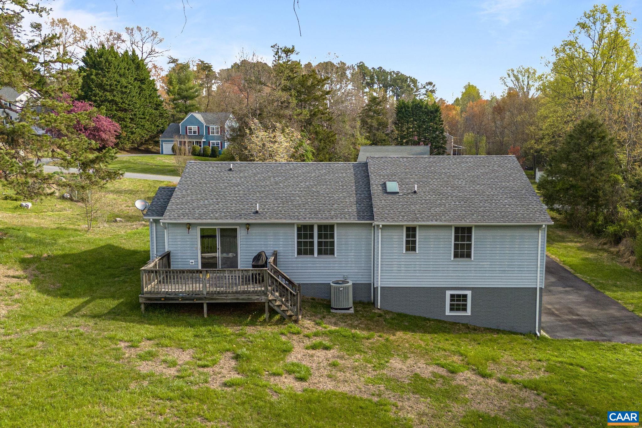 255 Rustling Oaks Way Ruckersville, VA 22968 - Photo 17 of 18 a front view of a house with garden