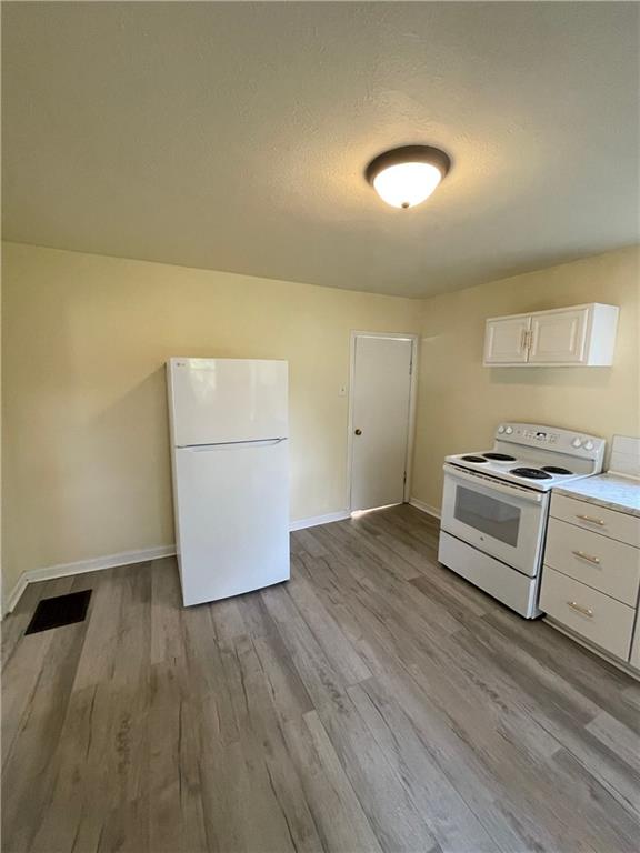 416 Sumner Avenue New Castle, PA 16105 - Photo 8 of 18 a kitchen with granite countertop a stove and a refrigerator