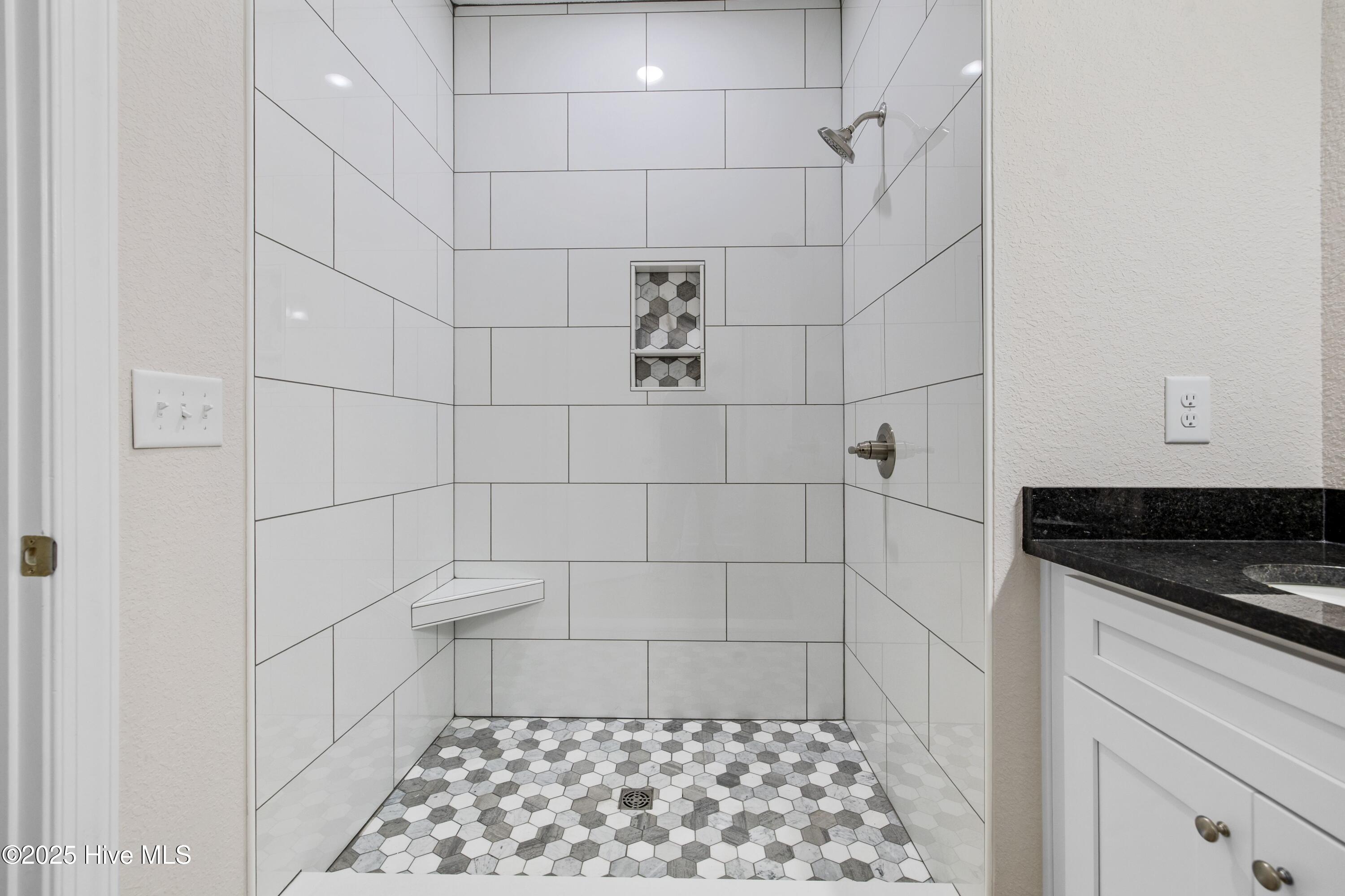 158 Texas Road Shiloh, NC 27974 - Photo 21 of 43 Custom Tile Shower with niche and bench.
