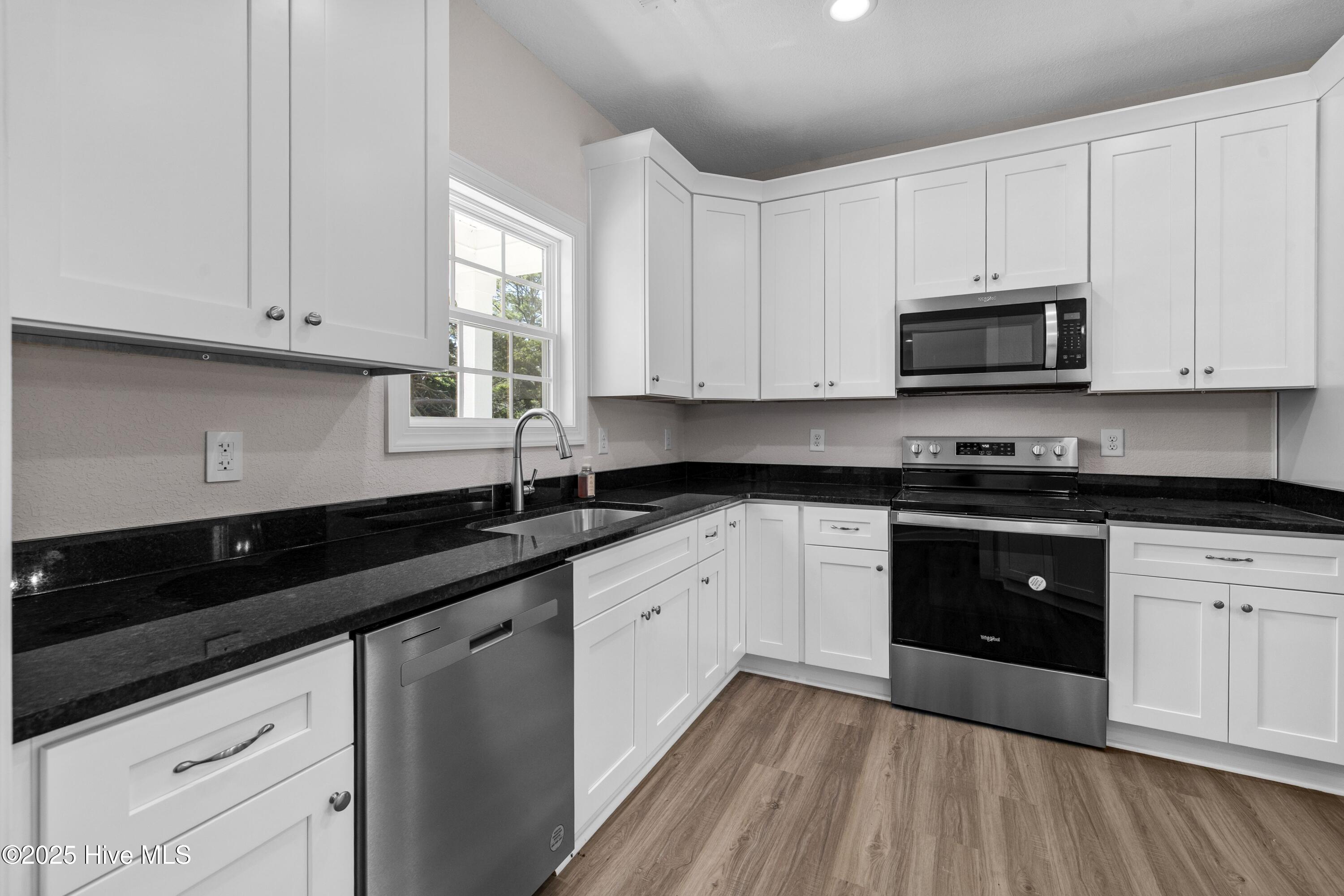 158 Texas Road Shiloh, NC 27974 - Photo 4 of 43 Modern kitchen with granite countertops.