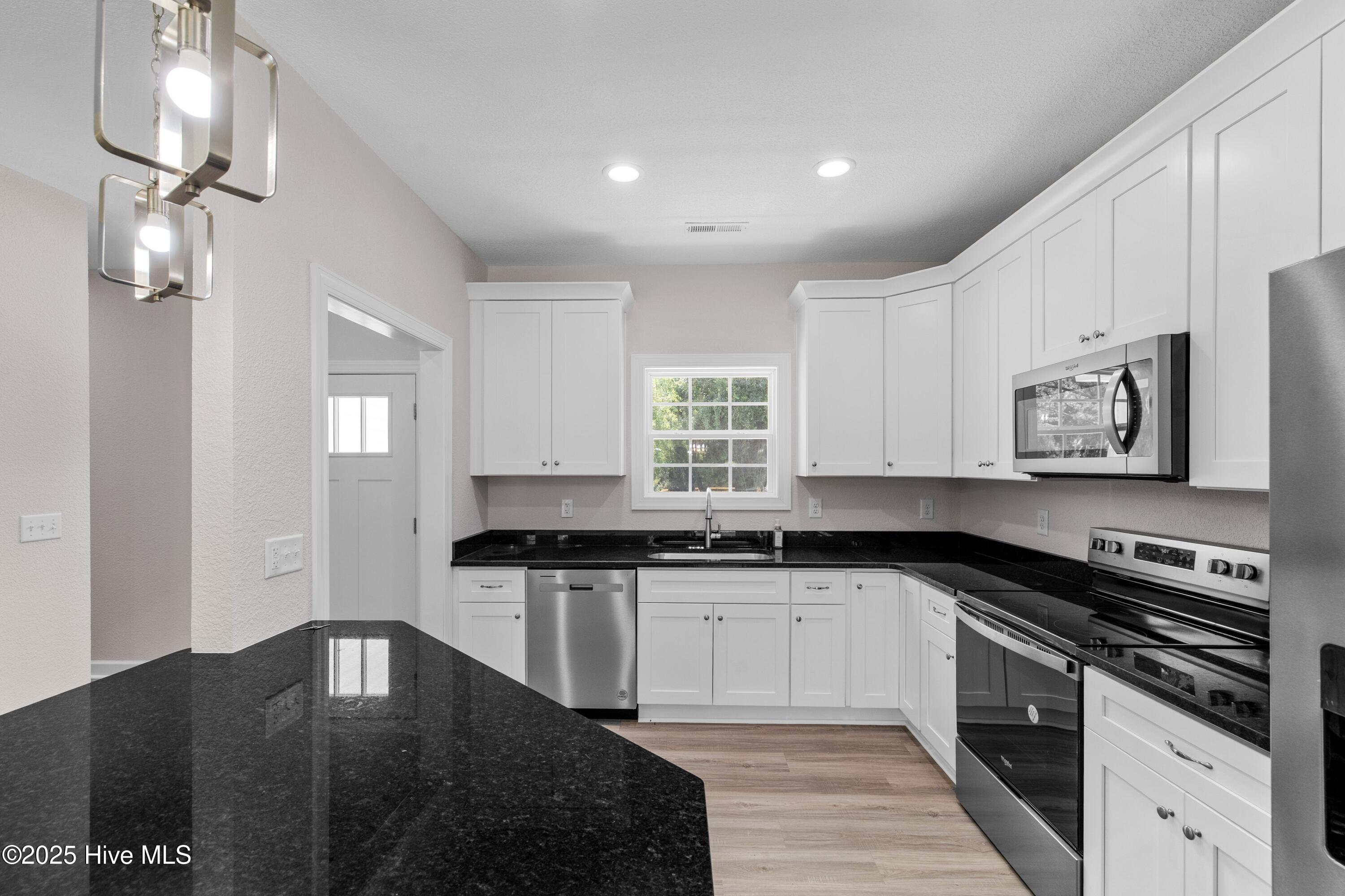 158 Texas Road Shiloh, NC 27974 - Photo 6 of 43 Bright and airy kitchen!