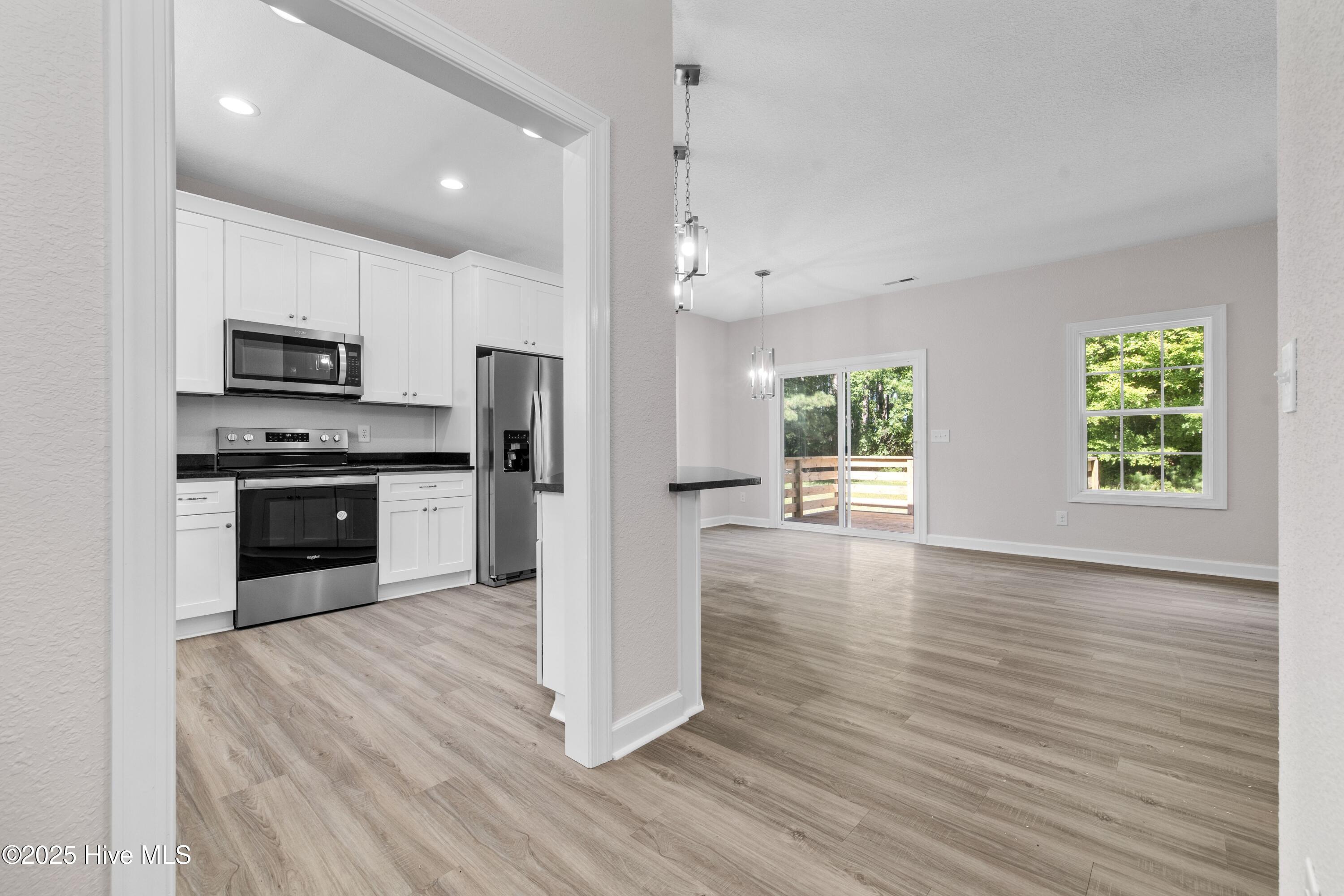 158 Texas Road Shiloh, NC 27974 - Photo 8 of 43 Front entry into kitchen, dining and great room.
