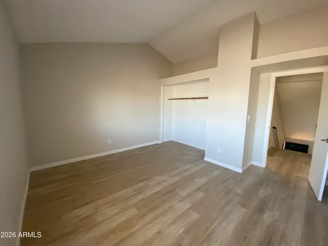 a view of a room that has a bed