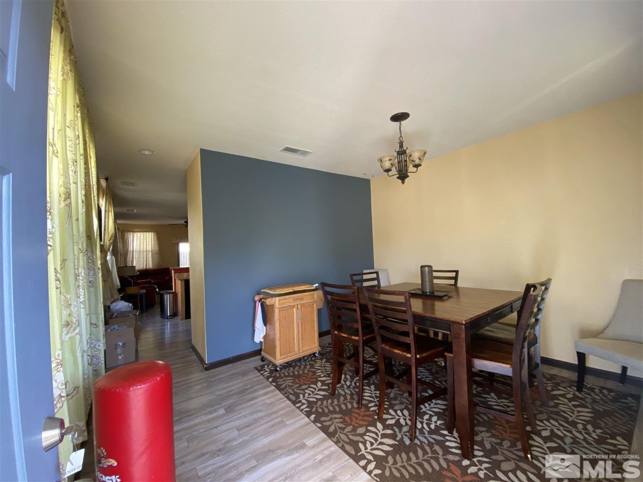 1935 Bears Ranch Drive Reno, NV 89521 - Photo 2 of 16 a view of a dining room with furniture and a chandelier