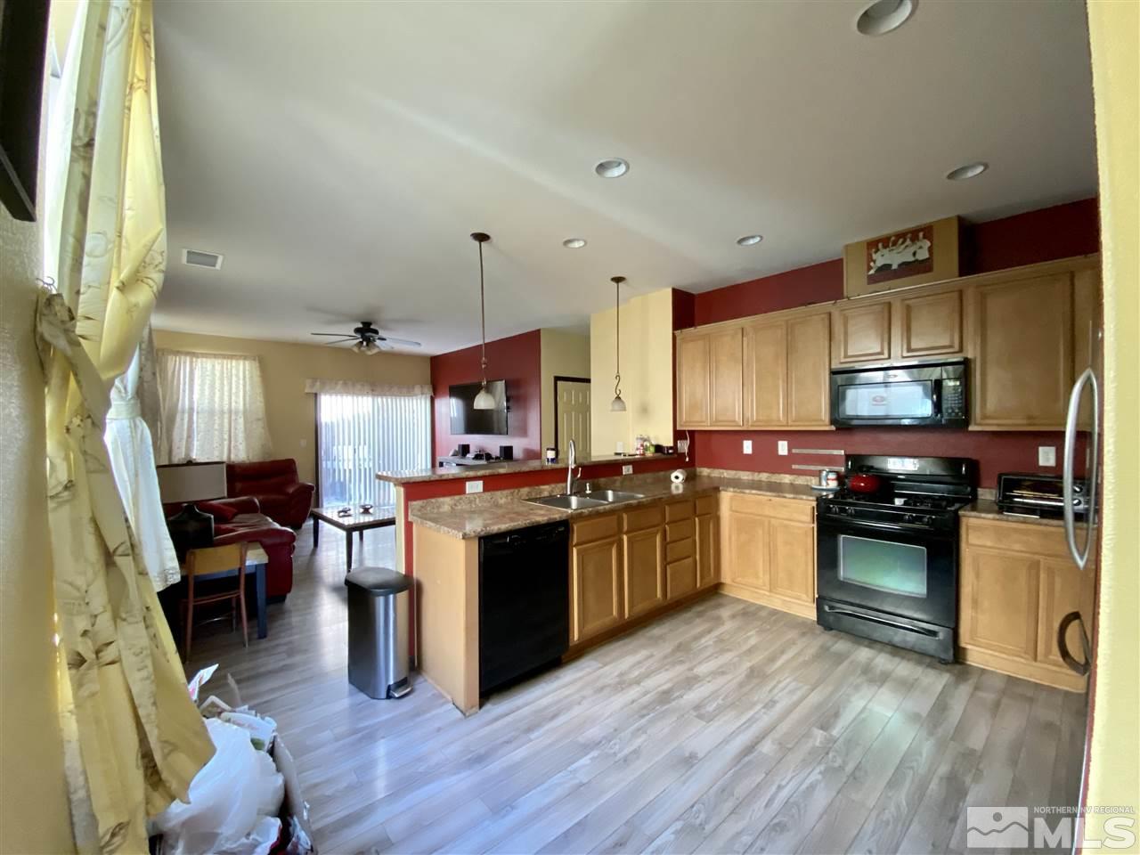1935 Bears Ranch Drive Reno, NV 89521 - Photo 3 of 16 a kitchen with a sink stove and cabinets