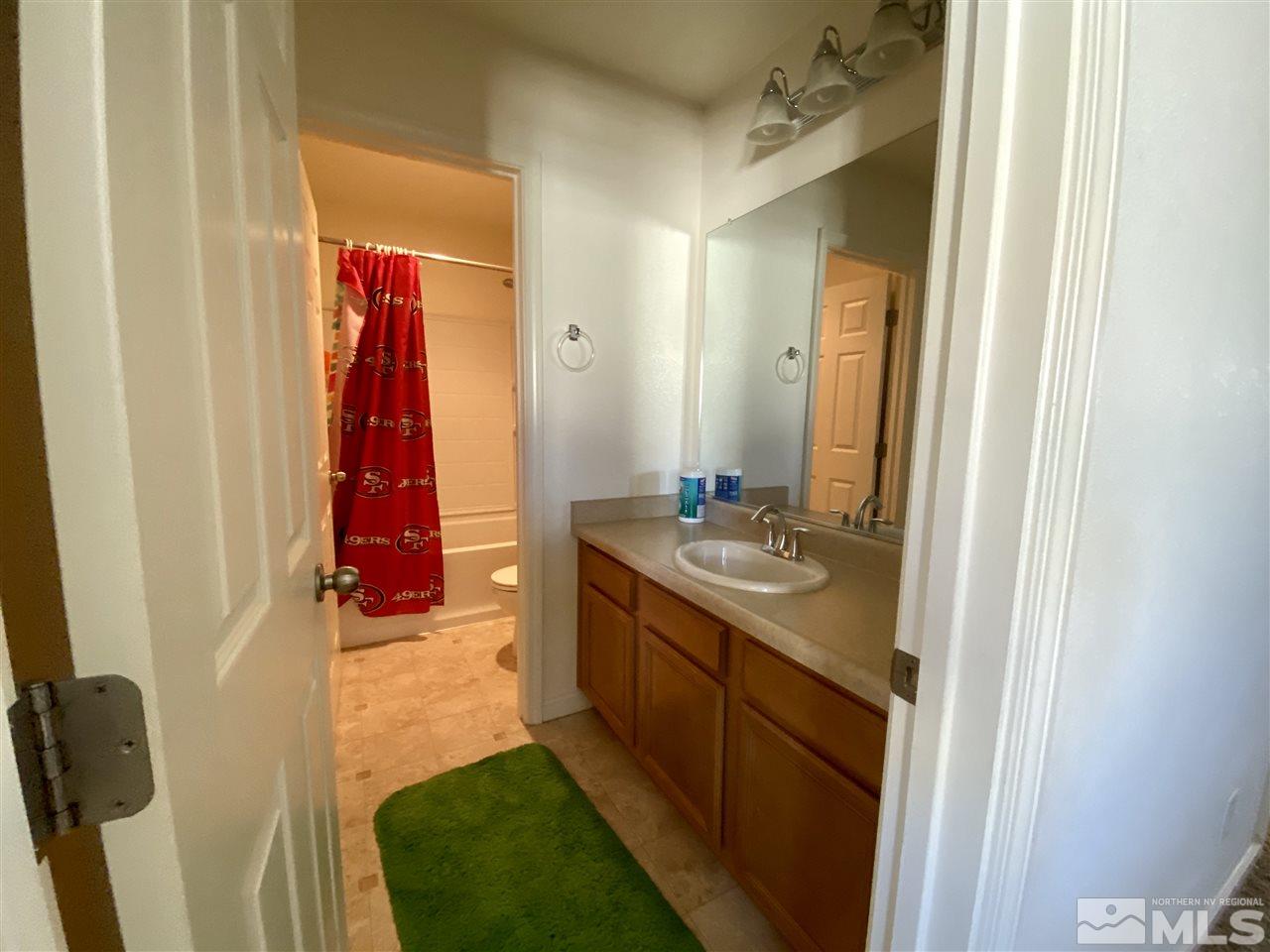 1935 Bears Ranch Drive Reno, NV 89521 - Photo 9 of 16 a bathroom with a sink and a mirror